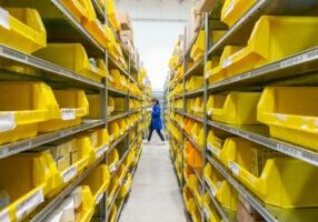 yellow plastic crates on white floor tiles